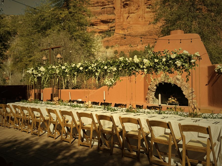 A long table beneath Sedona red rock